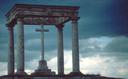 Storm clouds rolling in over the cross.